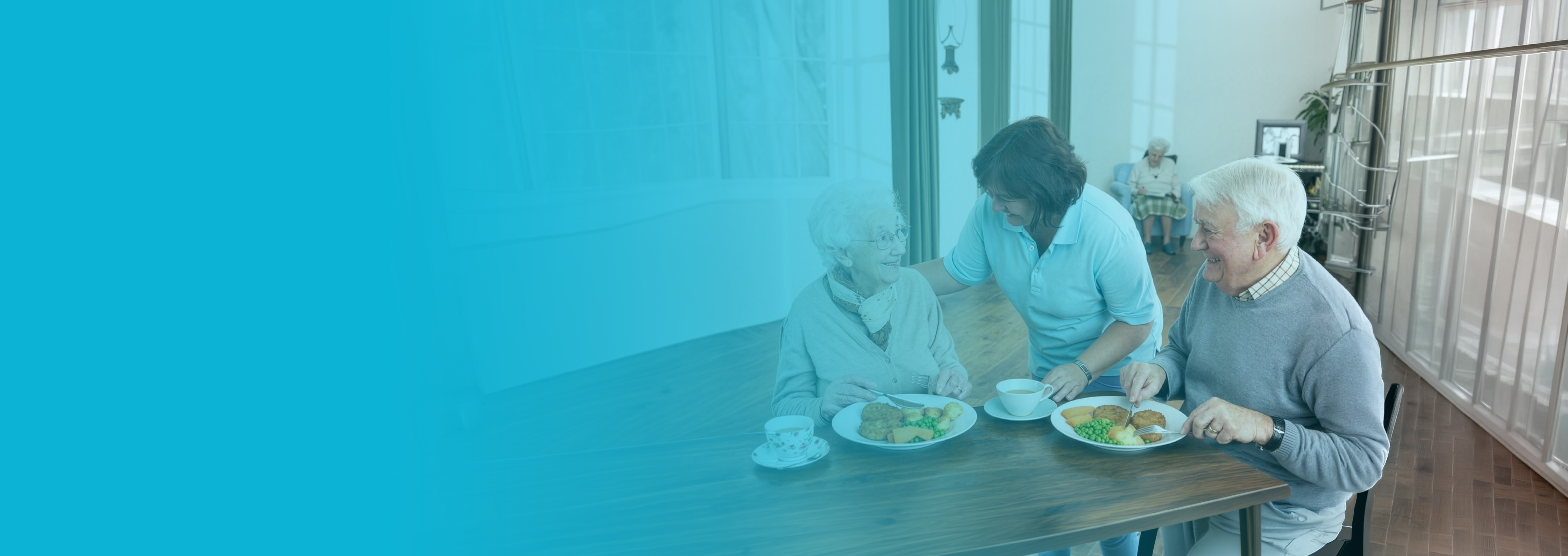 Caregiver serving a meal to elderly residents
